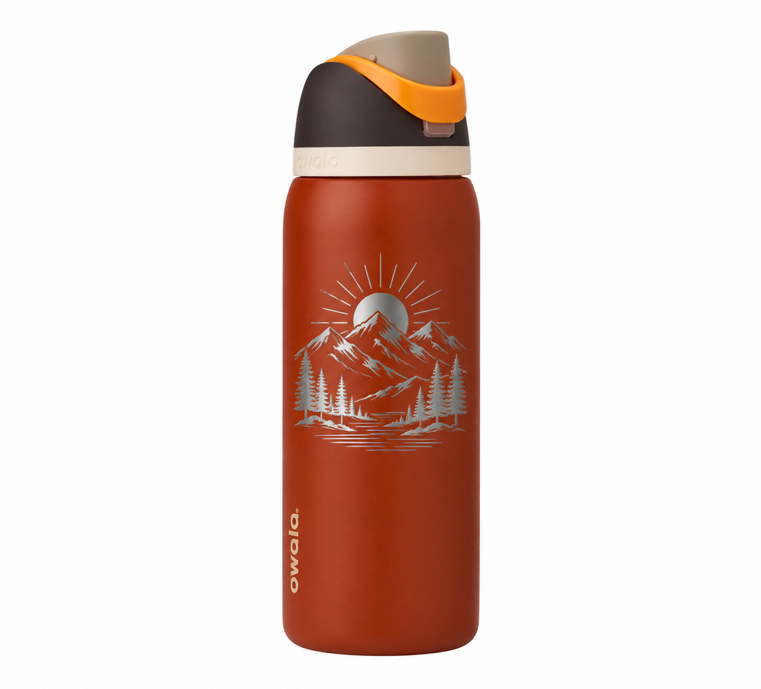 Owala 32 Ode to October with sample laser engraving: hiking and outdoor scene: minimalist mountain range, pine trees and a rising sun; no text